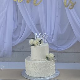 a wedding cake on a table a wedding cake on a table