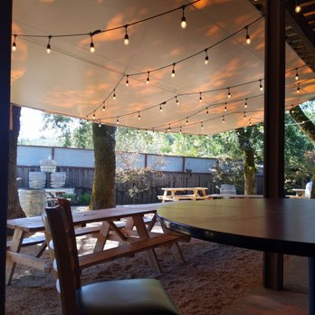 Mayo Family Winery - a table and chairs under a canopy - Wineries Near Me - Glen Ellen, California Mayo Family Winery - a table and chairs under a canopy - Wineries Near Me - Glen Ellen, California
