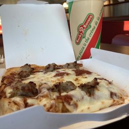 a slice of pizza and a drink