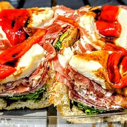 Yiasou Greek Market and Cafe - VILLAGE SANDWICH: PEPPERS, PROSCIUTTO, SALAMI, SOPRESSATA, FRESH MOZZ., EVOO, BALSAMIC, ARUGULA. $15