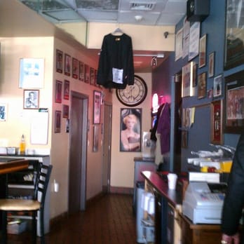 8/10 Bar & Grille - a man in a suit and tie - Italian Near Me - Everett, Massachusetts