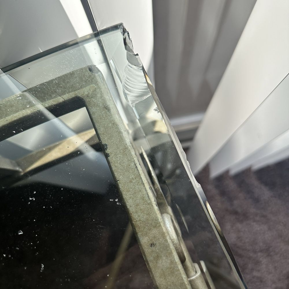This was the custom-made table that they dropped and damaged the glass. The glass is beveled and it is 2 inches thick. This was the custom-made table that they dropped and damaged the glass. The glass is beveled and it is 2 inches thick.