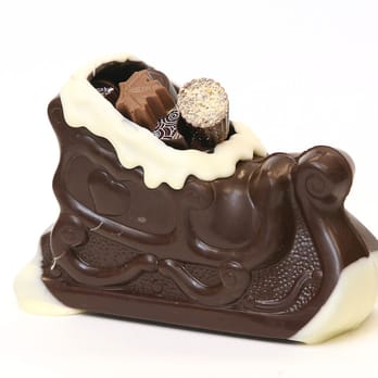Le Chocolatier - a chocolate sleigh filled with chocolates - Chocolatiers & Shops Near Me - Canmore, Alberta Le Chocolatier - a chocolate sleigh filled with chocolates - Chocolatiers & Shops Near Me - Canmore, Alberta