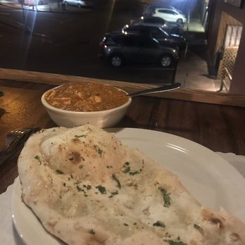 Himalayan Kitchen - Semi/outdoor seating at the bar. Garlic naan and Korma curry with eggplant and tofu. - Indian Near Me - Honolulu, Hawaii