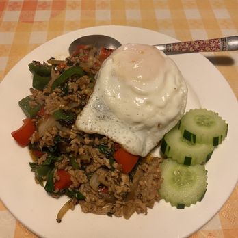 Thai Charlie's Restaurant - Spicy Thai basil chicken with rice. Added fried egg for $1.50. - Thai Near Me - Port Orchard, Washington Thai Charlie's Restaurant - Spicy Thai basil chicken with rice. Added fried egg for $1.50. - Thai Near Me - Port Orchard, Washington