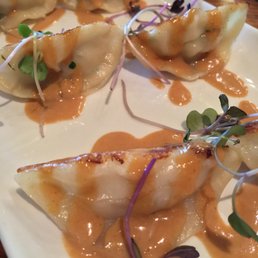 Chicken lemongrass pan-fried handmade dumplings with peanut sauce