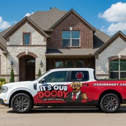 It's Our Doody - Service vehicle in front of customer's home.