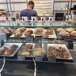 Almond Croissants, Pan au Chocolat, Raspberry Pastries, Cinnamon Rolls, Plain Croissants, Banana Bread, coffee, latte