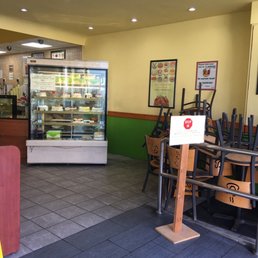 No more indoor seating. Background - Cakes on display