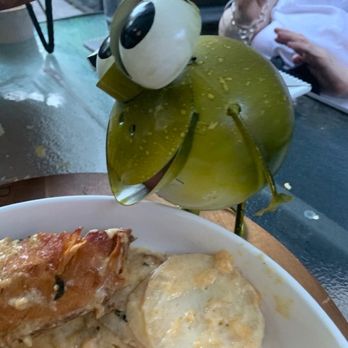 Deluxe Fun Dining - The frog looking over the Coco champagne chicken - Bars Near Me - Charlotte, North Carolina Deluxe Fun Dining - The frog looking over the Coco champagne chicken - Bars Near Me - Charlotte, North Carolina