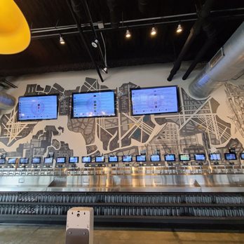 Navigator Taproom - Full selfserve tap with multiple glasses on the bottom - Beer Bar Near Me - Chicago, Illinois