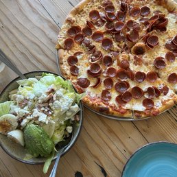 Pepperoni pizza and Cobb salad. Pepperoni pizza and Cobb salad.