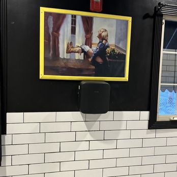 Curran's Irish Inn - Men's room art - Sports Bars Near Me - Bensalem, Pennsylvania