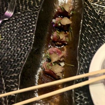Roka Akor - Chicago - Yellowtail Sashimi, Shallots, Poached Garlic Ponzu, Serrano Chili* - Sushi Bars Near Me - Chicago, Illinois Roka Akor - Chicago - Yellowtail Sashimi, Shallots, Poached Garlic Ponzu, Serrano Chili* - Sushi Bars Near Me - Chicago, Illinois