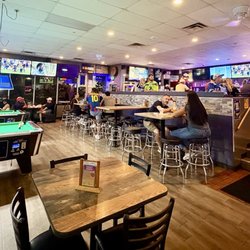 Skippy's Bar and Grill - Overview of the dining area that includes two pool tables