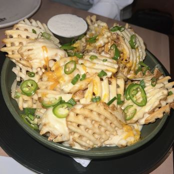 The Dirdie Birdie - Loaded Waffle Fries - Mini Golf Near Me - Austin, Texas The Dirdie Birdie - Loaded Waffle Fries - Mini Golf Near Me - Austin, Texas