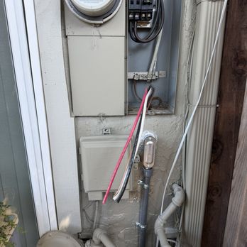 High Voltage Electric - Installing the new breaker along with all new wiring for the outlet. - Electricians Near Me