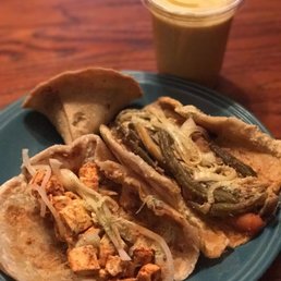 Paneer Kati roll, veggie Kati roll, samosa and a mango lassi.