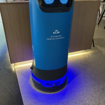 KLM Crown Lounge 52 - Friendly bus boy robot, you kinda have to walk quickly behind it to put your dishes on it's back shelf - Airport Lounges Near Me - Schiphol, New Hampshire