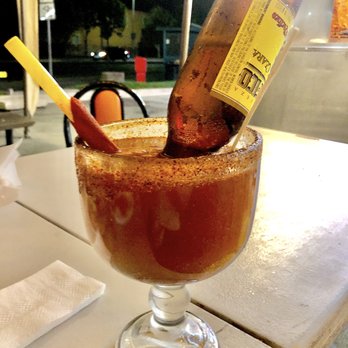 El Chalateco - Super Michelada with a straw wrapped in tamarindo - Salvadoran Near Me - San Jose, California El Chalateco - Super Michelada with a straw wrapped in tamarindo - Salvadoran Near Me - San Jose, California