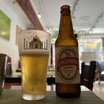 Pongal restaraunt nyc - a glass of beer and a beer bottle on a table - Indian Near Me - Manhattan, New York Pongal restaraunt nyc - a glass of beer and a beer bottle on a table - Indian Near Me - Manhattan, New York