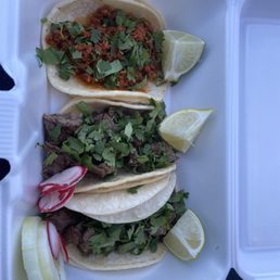 One chorizo taco and two arrachera tacos (no onions).