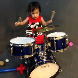 Kidzville Play and Party Center - Playing with the kid-sized drum set