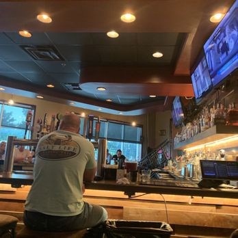 The Griffin Tavern - a man sitting at the bar - Cocktail Bars Near Me - Denver, Colorado