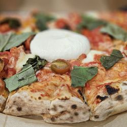 Benji’s Woodfire Pizza - His Margherita Pizza with a generous dollop of Buratta in the middle (half of long family pie)