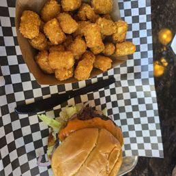 Double cheese burger and super yummy tots!!.