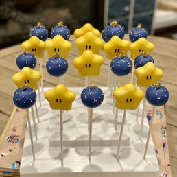 Mario Star cake pops with funfetti, and blue round cake pops with vanilla filling. Mario Star cake pops with funfetti, and blue round cake pops with vanilla filling.