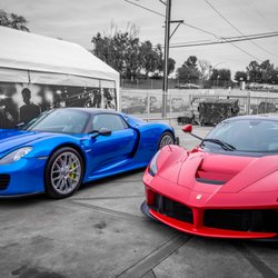 Photo of Sticker City - Sherman Oaks, CA, US. Blue vehicle wrap on Porsche 918 and Xpel Ultimate on Ferrari LaFerrari.
