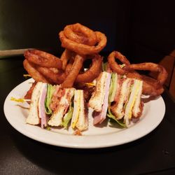 Thommy Mac's - Triple Decker Club with Blooming Onion Rings.