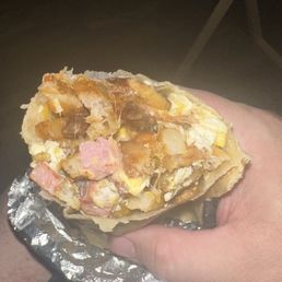 Bacon and Ham breakfast burrito. Bacon and Ham breakfast burrito.