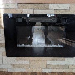 My Home Handyman - Fireplace installation with brick surrounding it.