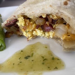 New breakfast burrito with their green salsa and grilled jalapeño. (Bacon is a bit hard) but still good. New breakfast burrito with their green salsa and grilled jalapeño. (Bacon is a bit hard) but still good.
