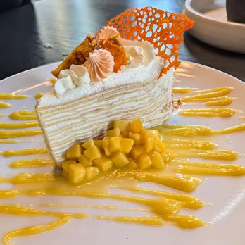 The Ledger - I adore mille crepe cake. This one with passionfruit curd and a coconut tuile was exceptional. - American Near Me - Plymouth, Michigan The Ledger - I adore mille crepe cake. This one with passionfruit curd and a coconut tuile was exceptional. - American Near Me - Plymouth, Michigan