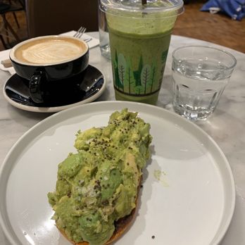 Mr West Cafe Bar Downtown - Almond milk latte (very bitter), world's best avocado toast on sweet potato - Bars Near Me - Seattle, Washington