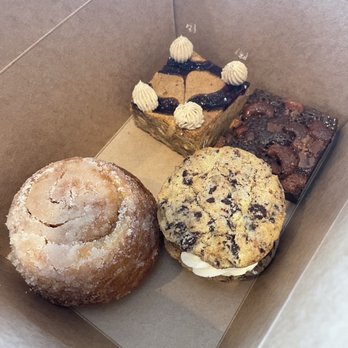 Community Matters Cafe - Morning bun, chocolate chip cookie, cashew brownie, and a PB&J Blondie in the back - Breakfast & Brunch Near Me - Charlotte, North Carolina