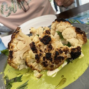 Kyu - He just couldn't wait lol... the roasted cauliflower, goat cheese, and sauce was delicious. Crowd favorite. - Asian Fusion Near Me - Miami, Florida Kyu - He just couldn't wait lol... the roasted cauliflower, goat cheese, and sauce was delicious. Crowd favorite. - Asian Fusion Near Me - Miami, Florida