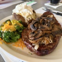 Huntington's Steakhouse - Ribeye with sautéed mushrooms and onions, a baked potato, and a side of fresh steamed broccoli with cheddar. Absolutely fabulous.