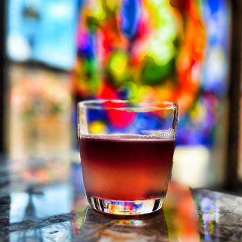 Graham Rooftop Lounge - a shot of a drink in front of a stained glass window - Lounges Near Me - York, Pennsylvania Graham Rooftop Lounge - a shot of a drink in front of a stained glass window - Lounges Near Me - York, Pennsylvania