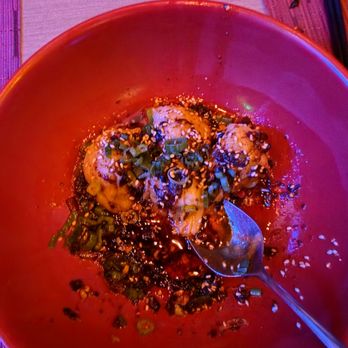 CHĪ Asian Kitchen - Spicy Dumplings.  3 were on our plates already, and they were delicious! - Chinese Near Me - Las Vegas, Nevada