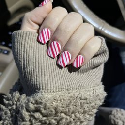 Acrylic nails with a candy cane design