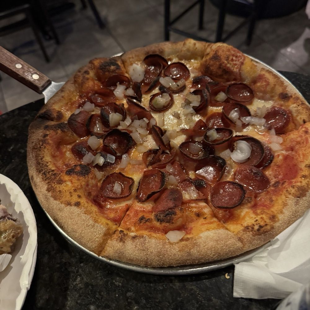 Za with onions and pepperoni