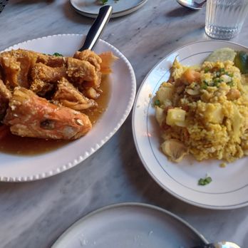 Kitchen 79 - Fish with garlic sauce and a pineapple fried rice. Tasty!! - Thai Near Me - Jackson Heights, New York Kitchen 79 - Fish with garlic sauce and a pineapple fried rice. Tasty!! - Thai Near Me - Jackson Heights, New York