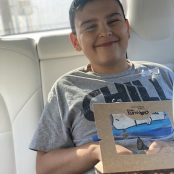 Chocolate Bash - Happy with his special treat from chocolate bash - Chocolatiers & Shops Near Me - Newport Beach, California