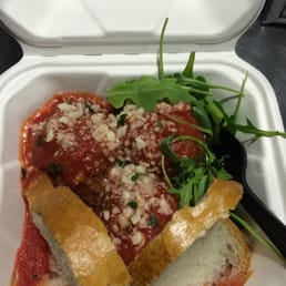 Three different meatballs: beef, veal and pork with arugula and sourdough bread Three different meatballs: beef, veal and pork with arugula and sourdough bread