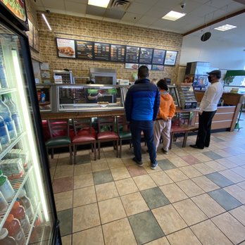 Subway - a couple of people standing at a counter - Fast Food Near Me - Stamford, Connecticut
