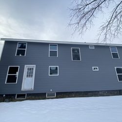 Kuhn Construction - New vinyl siding new windows new doors and facia metal